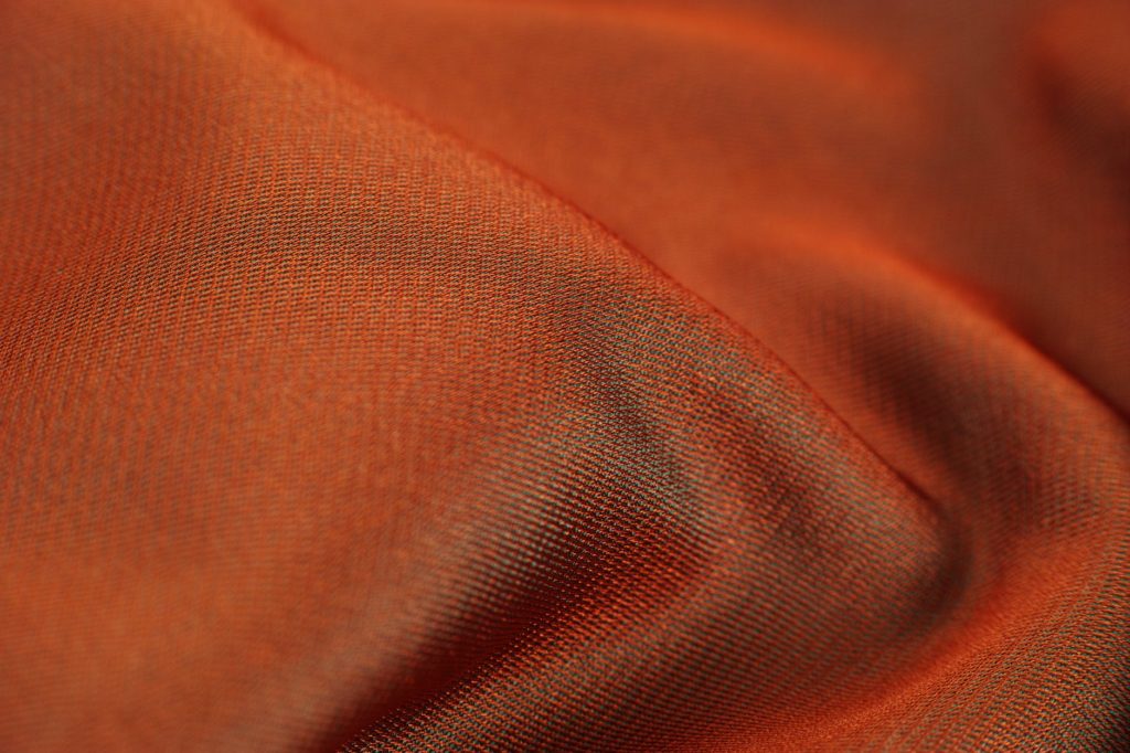 closeup photo of orange cloth