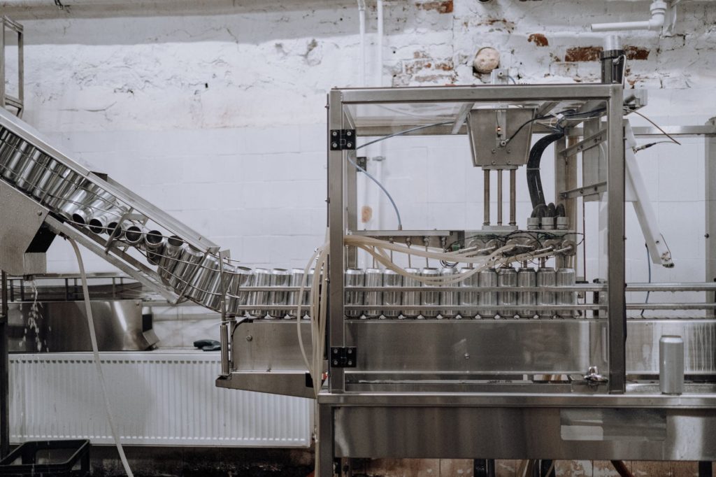 aluminum cans passing through the assembly line